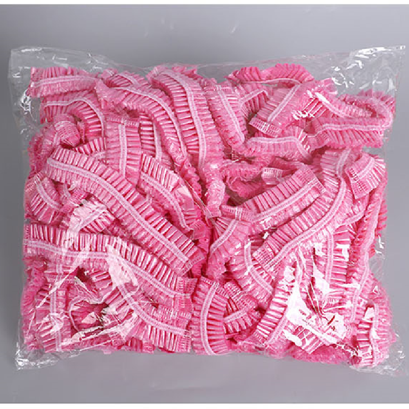 100 pçs/set tampão de cabelo de chuveiro plástico descartável feminino à prova dpink água rosa spa salão de beleza do hotel tintura de cabelo elástico touca de banho rosa