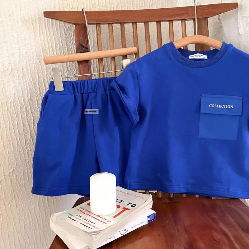 Sommer 0-6-jahr-alte Jungen und Mädchen Einfache Brief Kurzarm Anzug Baby Baumwolle Große Tasche top T-shirt Kurze Lässige Sportswear