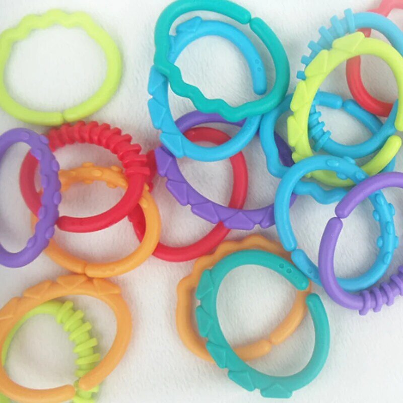 8Pcs/Set Baby Teether Rattles Toy Ring Rubber Rainbow Ring Molars Rattle Safety Toys for Children Crib Bed Stroller Hanging Ring