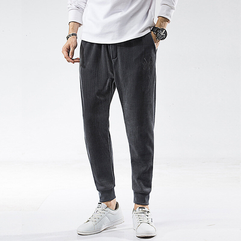 Modna marka Plus aksamitne spodnie dresowe męskie spodnie polarowe nowe nowe zimowe pogrubienie ciepłe stopy elastyczne męskie spodnie