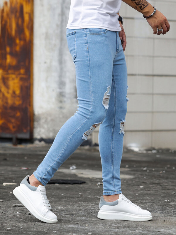 بنطلون جينز رجالي ضيق ممزق باللون الأزرق على الموضة من Streetwear بنطلون جينز غير رسمي ربيعي جديد للرجال للركض من الجينز للرجال