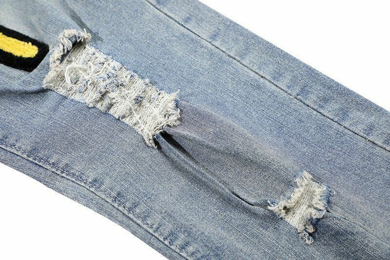 Jeans Baru Jeans Amerika Street Smiley Bordir Berkelompok, Celana Panjang Pria High Street Hip Hop Lubang Tertekan Lurus Dicuci