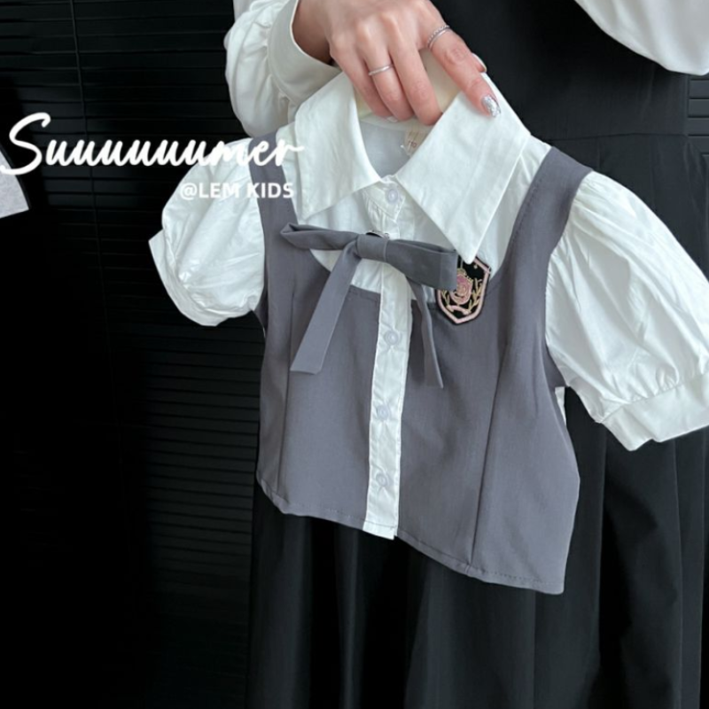 ชุดเสื้อผ้าเด็กทารกหญิง2023ใหม่ฤดูร้อนชุด kemeja lengan pendek กระโปรงเด็กเกาหลีชุดสองชิ้นเครื่องแบบ JK ของเด็กผู้หญิง