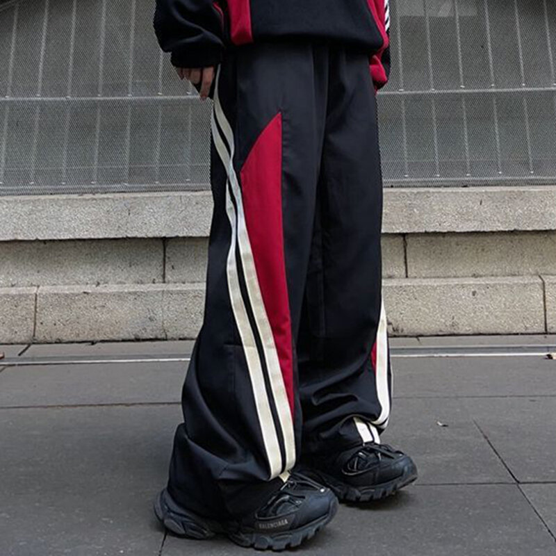 Spodnie w stylu amerykańskim luźne paski kontrastowe spodnie z prostymi nogawkami funkcjonalne spodnie z szerokimi nogawkami męskie sporty uliczne i wygodne spodnie
