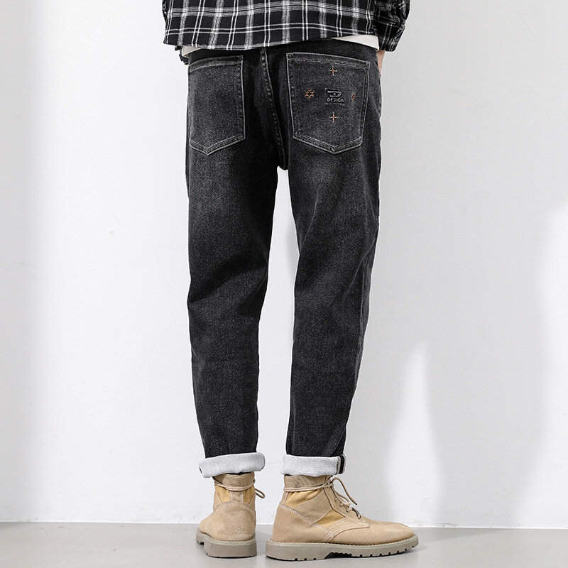 Małe proste czarne męskie jeansy modne młodzieżowe spodnie w pasie jesienne i zimowe podmiejskich stretch casual męskie spodnie.