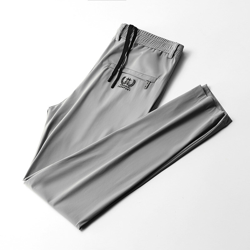 Pantalones de trabajo informales para hombre, pantalón de cintura elástica fina, de Color sólido, con apliques de bolsillo, a la moda, para primavera y verano, 2022