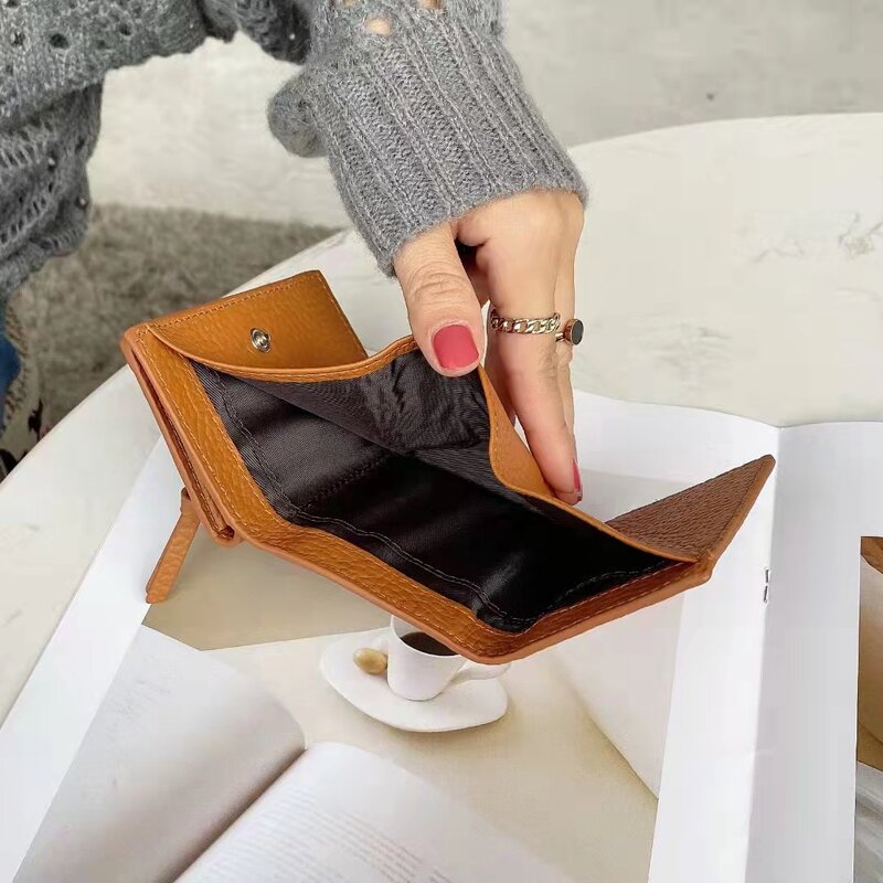 Portafoglio di lusso portafoglio corto in pelle 100% portafoglio moda piccolo portafoglio fibbia Design portafoglio portafoglio