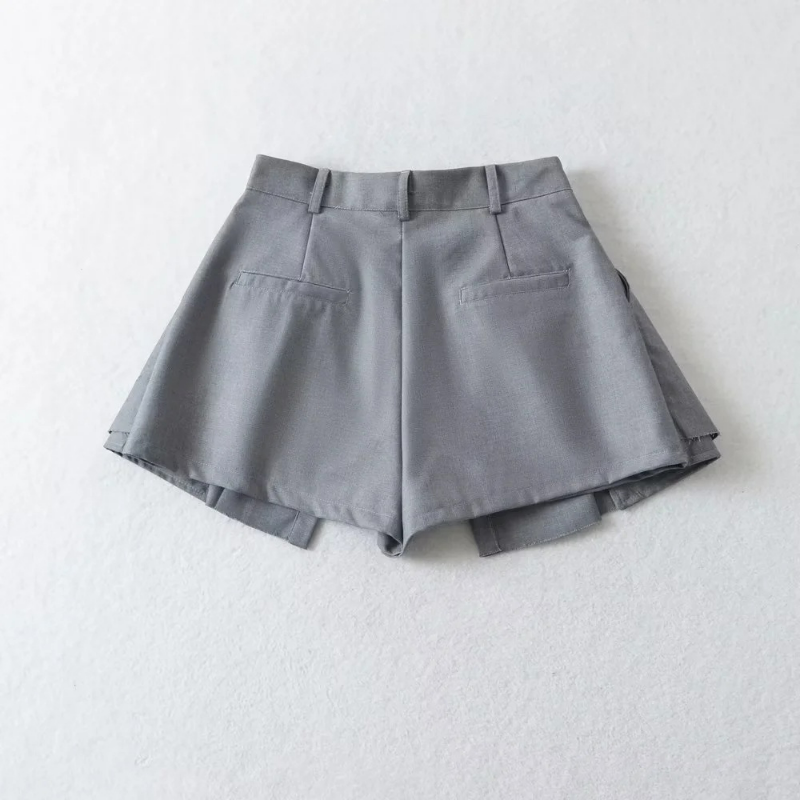 Pantalones cortos plisados para mujer, faldas falsas de dos piezas, pantalones sexys con contraste de Color, cintura Irregular, antiexposición