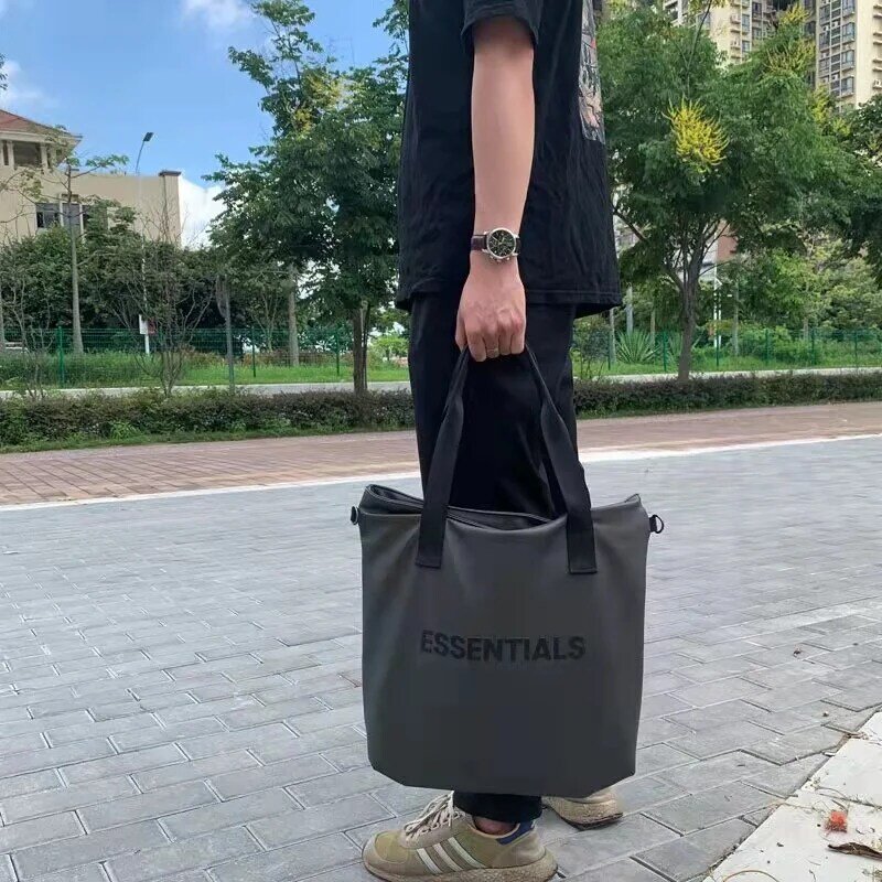 Essentials diagonal straddle saco moda masculina e feminina único ombro portátil de dupla finalidade saco de lazer escritório maleta