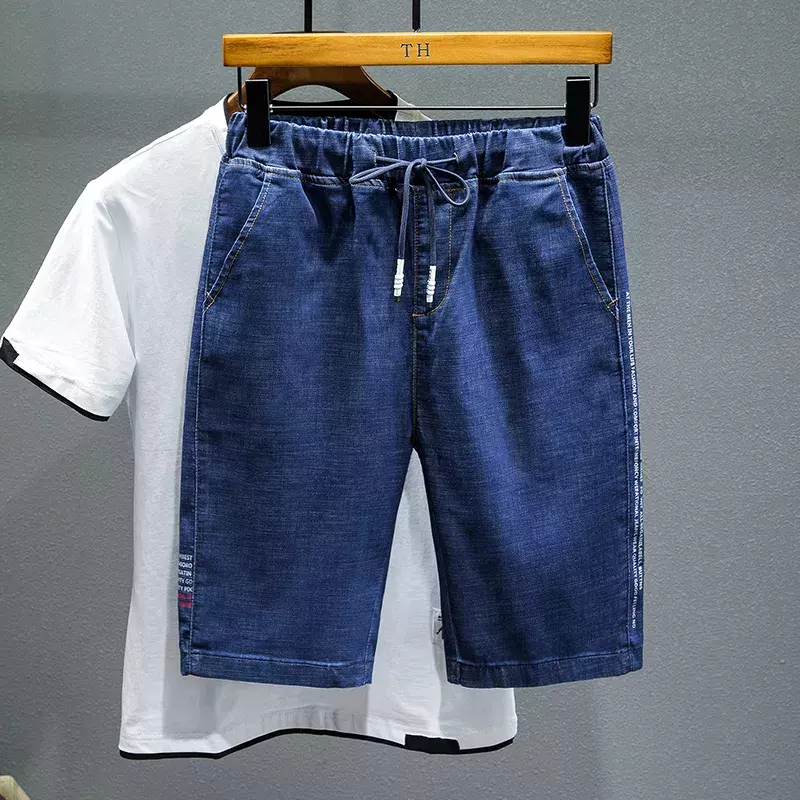 Plus Size 5XL 6XL 7XL Jeans corti con coulisse da uomo moda Casual lettera stampa pantaloncini di Jeans elasticizzati larghi maschio nero blu