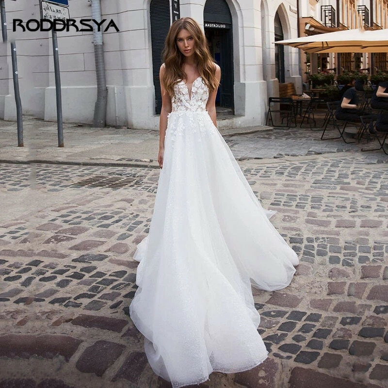 Rodddrsya Bling Backless-line suknia ślubna bez rękawów koronkowe aplikacje wesele Glitter Tulle pociąg szata De Mariee