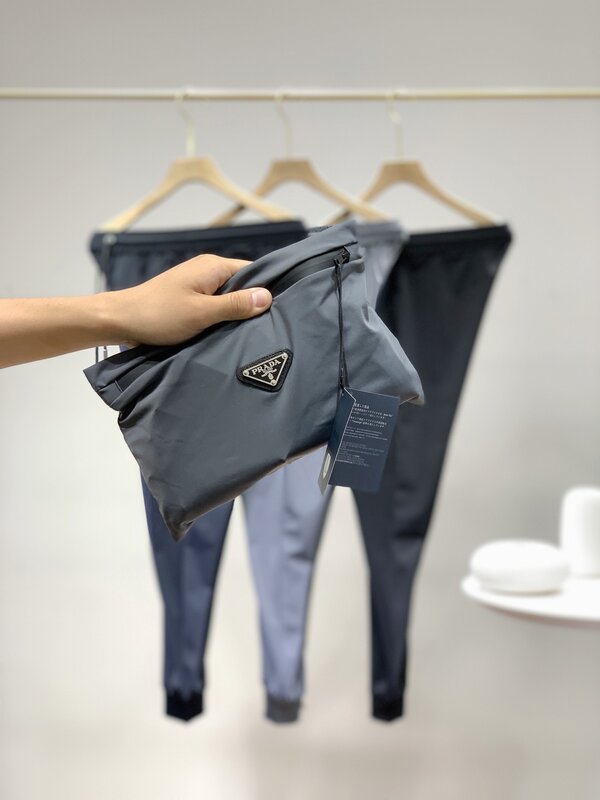 21ss novo design da marca de luxo pràda respirável calças de cintura elástica das mulheres dos homens moda esporte jogger moletom calças ao ar livre